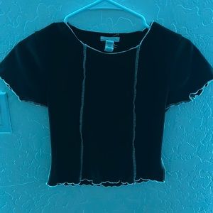 A black shirt with a few small white stripes